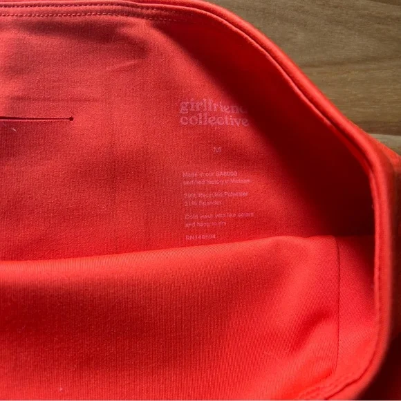 Medium Girlfriend Collective Bike Shorts In Orange and Dark Green - Picture 2 of 4